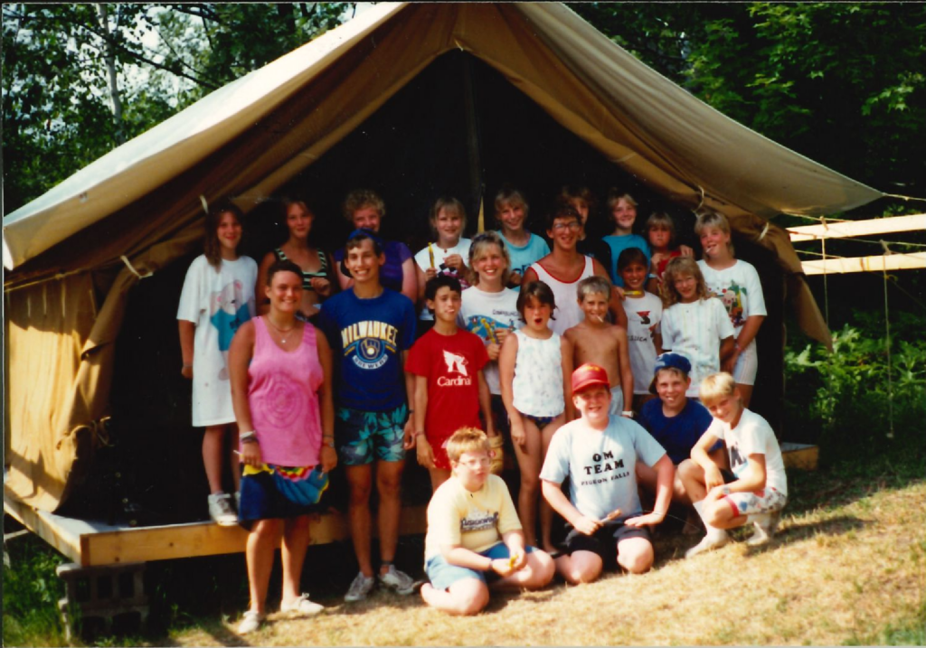 Campers at platform tent, Luther Woods Housing during summer